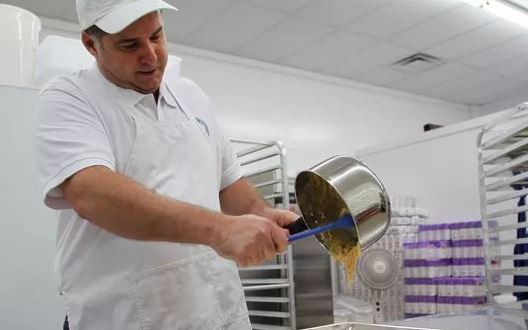 Granny's Confections Handmade Peanut Brittle Owner Robert Page Stirring Brittle